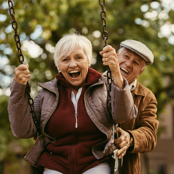 senior couple on swing