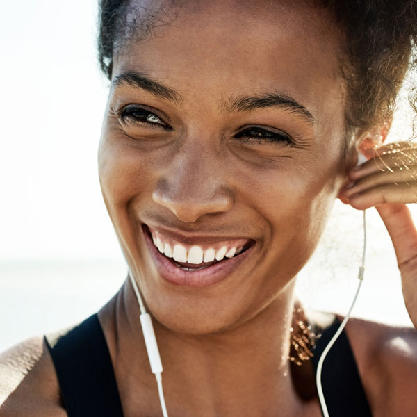 young smiling woman with headphones