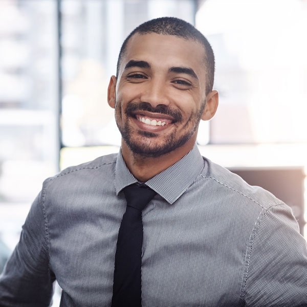 smiling man wearing tie
