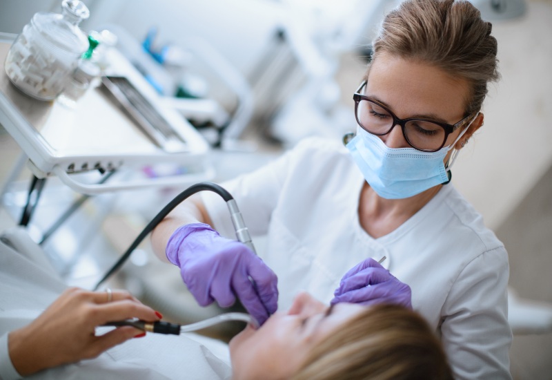 Dentist performing dental filling treatment in Antioch, IL