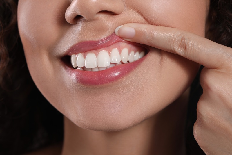 Close-up of healthy gums and teeth during self-check in Arlington Heights, IL